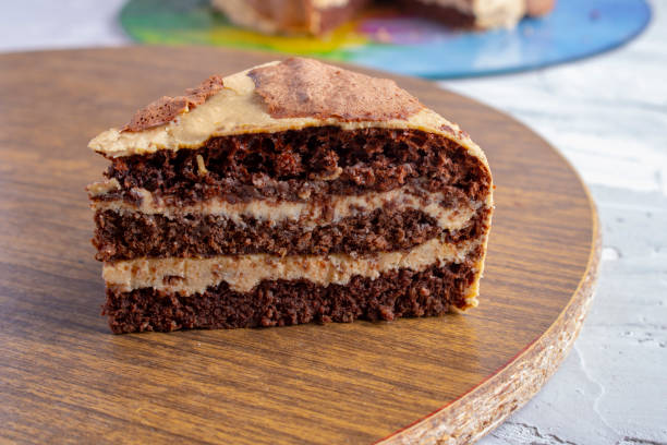istock Slice of gluten free chocolate cake on kitchen board 1238000352
