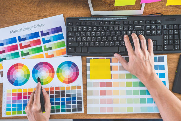 istock Image of male creative graphic designer working on color selection and drawing on graphics tablet at workplace with work tools and accessories in workspace 1238006772