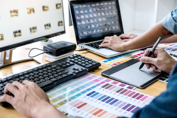 istock Young creative team having a meeting in creative office, Architectural drawing with work tools and accessories, Color swatch samples chart for selection coloring 1238006787
