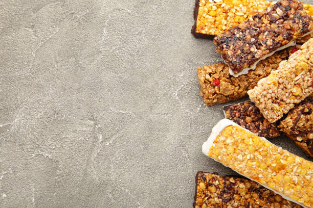 istock Granola bars on grey background with copy space. Diet and breakfast 1238007997