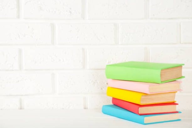 istock Multi coloured school books on a white background with copy space. 1238008065