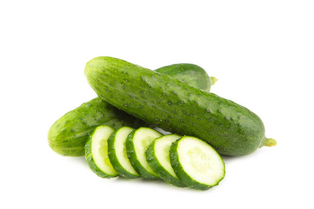istock Fresh cucumbers and slices isolated over white background. 1238008238