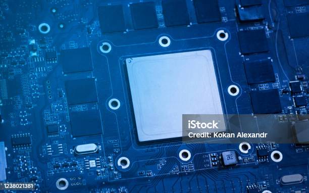 Board With A Chip A Chip On A Blue Background Stock Photo - Download Image Now - Abstract, Blue, CPU