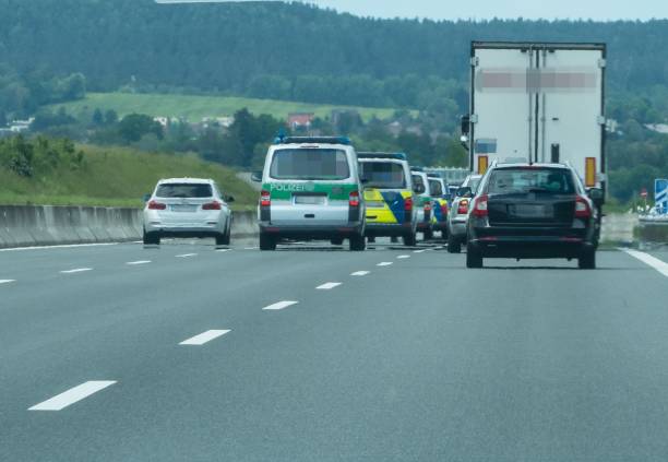 istock Police Cars driving on Highway 1238027687