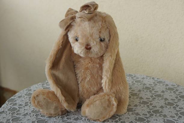 istock one brown soft toy hare stands on a white table 1238035647