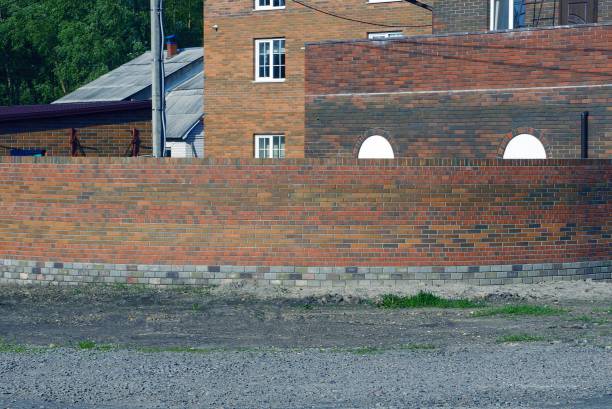 istock long brown brick wall of a fence 1238038764