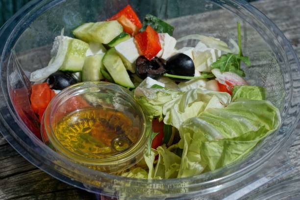istock fresh greek salad food in a plastic transparent box 1238039278