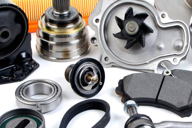 istock Auto parts background. Hub, pump, brake pads, filter, timing belt, rollers, constant velocity joints, thermostat and other on white background. Set of spare parts for repair 1238044997