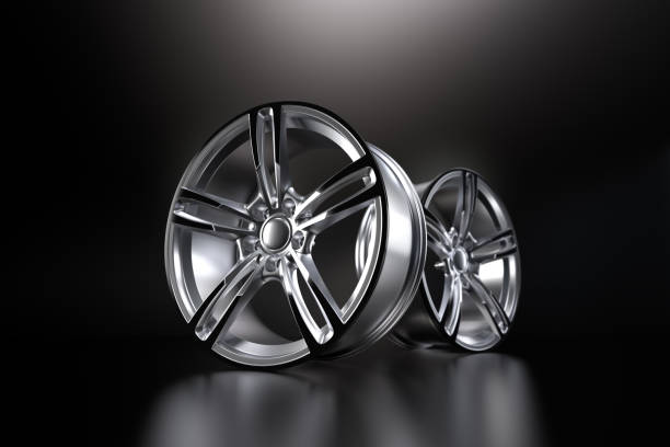 Aluminium alloy car wheel. Red alloy rim for car, tracks on black background. 3d rendering illustration