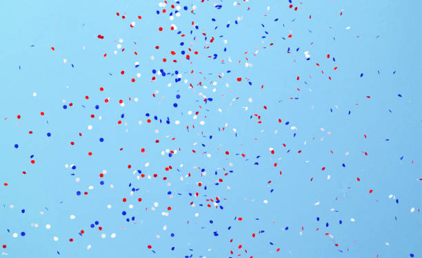 istock Circle Shaped Paper Confetti in American Flag Color Falling over Blue Background 1238068113