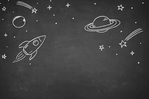 Business startup concept with space shuttle drawing on black chalkboard