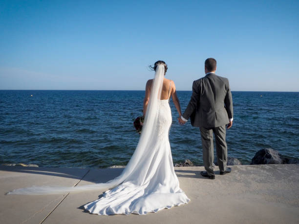 istock Newlyweds looking out to sea 1238076091