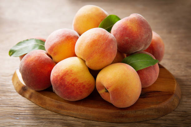 istock fresh peaches on a wooden table 1238088674