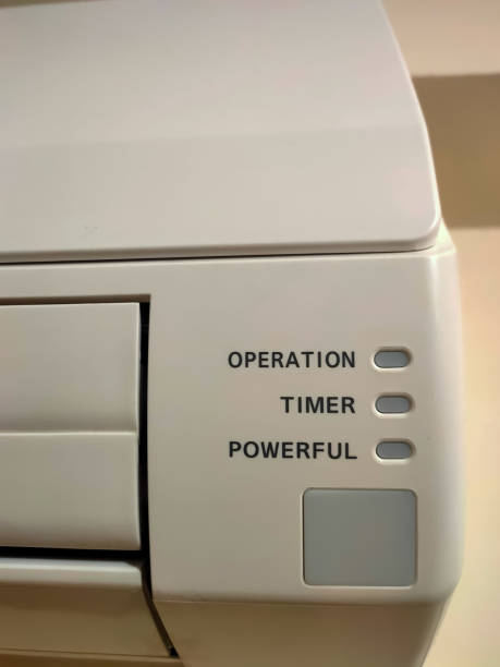 istock Closeup of split air conditioner on a white wall. 1238158711