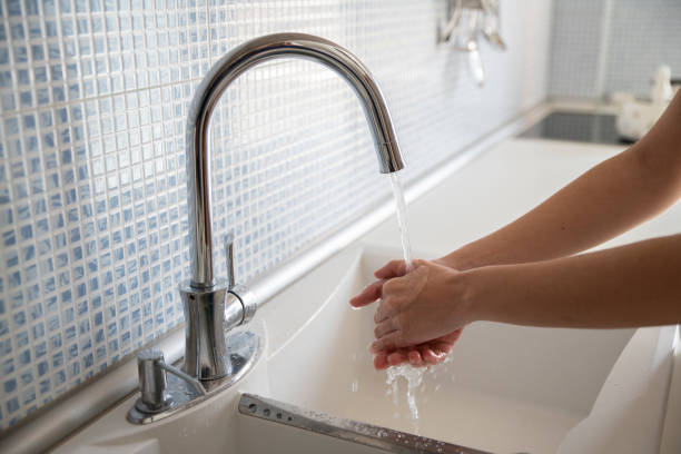 istock Woman washing her hands with soap, corona virus 1238186077
