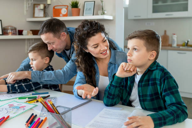 istock Parents Helping Children With Homework at Home 1238195310