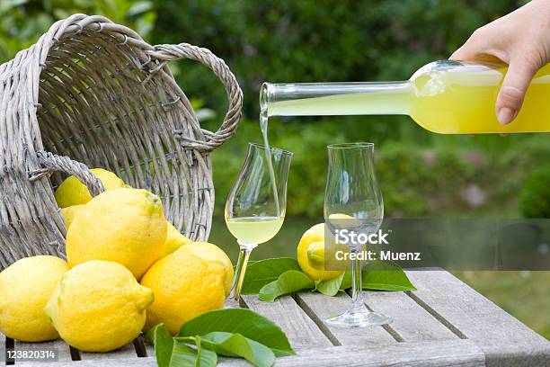 Limoncello And Lemons Stock Photo - Download Image Now - Alcohol - Drink, Basket, Bottle