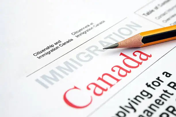 Close up of pencil on immigration form