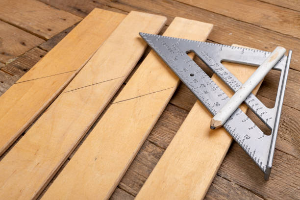 istock Drawing a line in a carpentry shop using an angle bar. Small carpentry work in the workshop. Light background. 1238214336