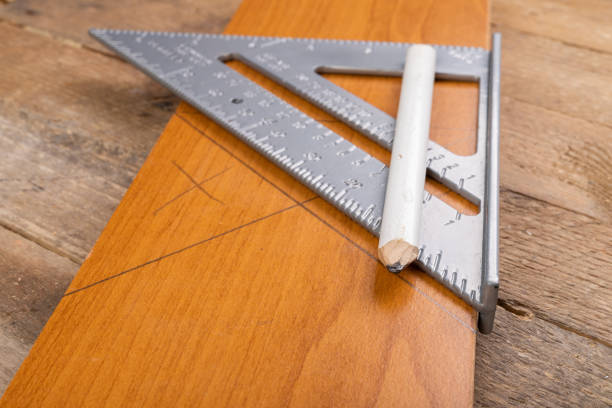 istock Drawing a line in a carpentry shop using an angle bar. Small carpentry work in the workshop. Light background. 1238214855