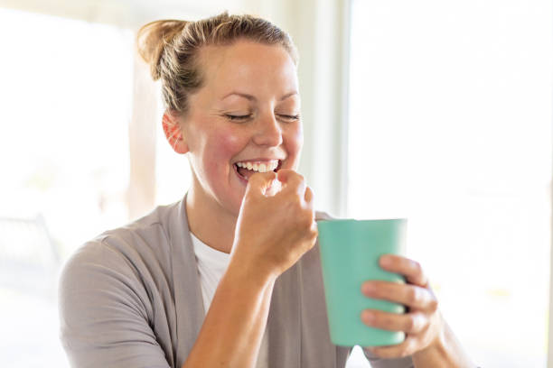 istock Natural Beauty Millennial Female Taking Supplements 1238222218