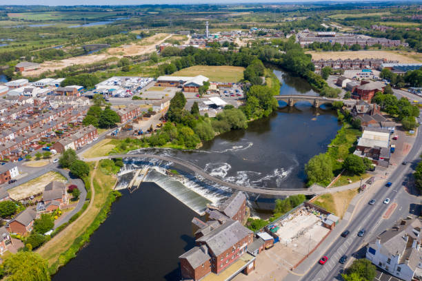 Aerial photo of the village centre of Castleford in Wakefield, West Yorkshire, England showing the main street along side the River Aire on a bright sunny summers day stock photo