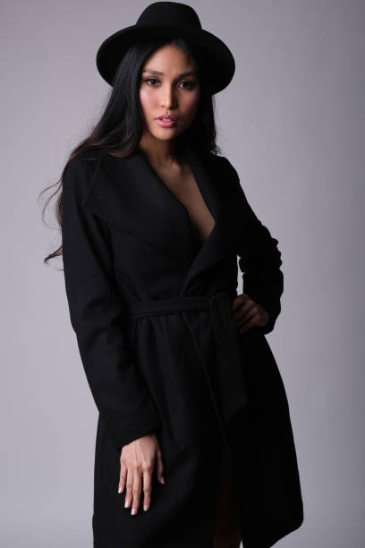 istock Elegant asian model in black coat. 1238230006