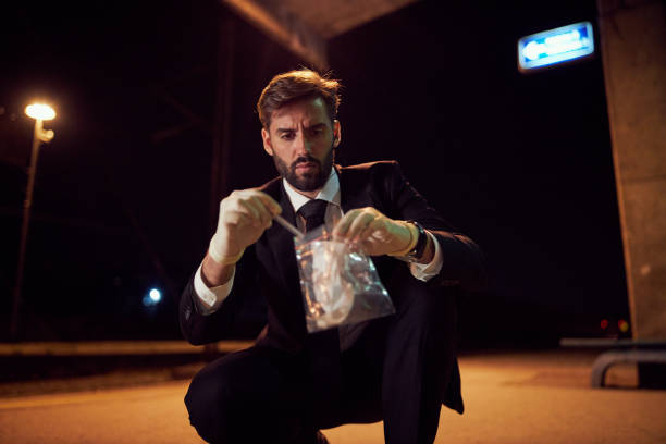istock Forensics police expert putting evidence in a plastic bag 1238243997