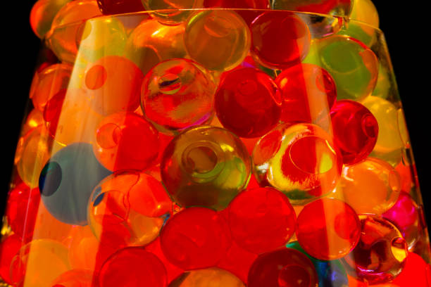istock multi-colored silicone gel balls in a glass on a black background 1238244031