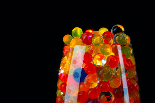 istock multi-colored silicone gel balls in a glass on a black background 1238245595
