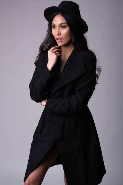 istock Elegant asian model in black coat. 1238247685