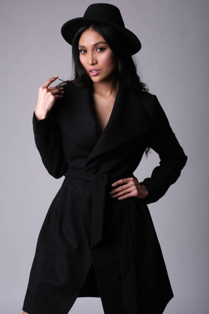 istock Elegant asian model in black coat. 1238247686