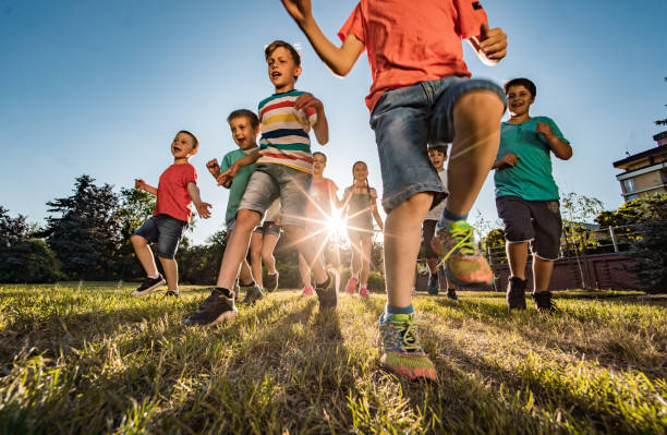istock Kids running in nature 1238247693