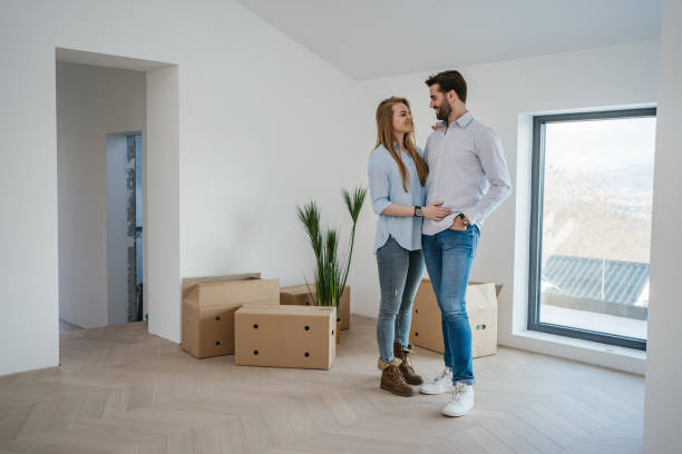 istock Young couple bonding during new house decoration 1238256675