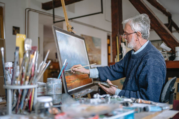istock Senior artistic man painting 1238256848