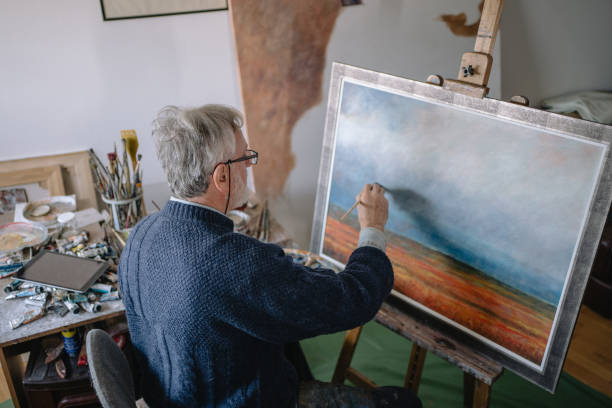 istock Senior man relaxing during a painting session 1238256886