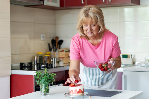 istock Senior woman making a cake 1238266572