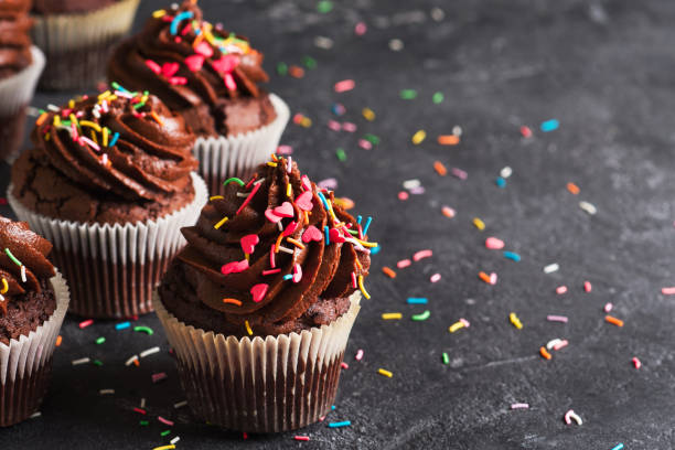 istock Chocolate cacao cupcakes with sprinkles 1238279638