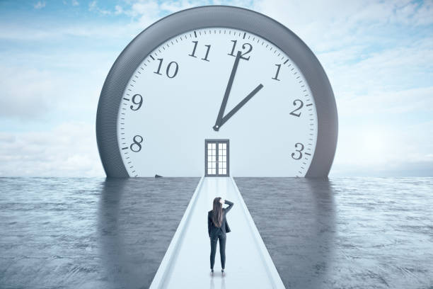 istock Businesswoman looking on clock 1238300512