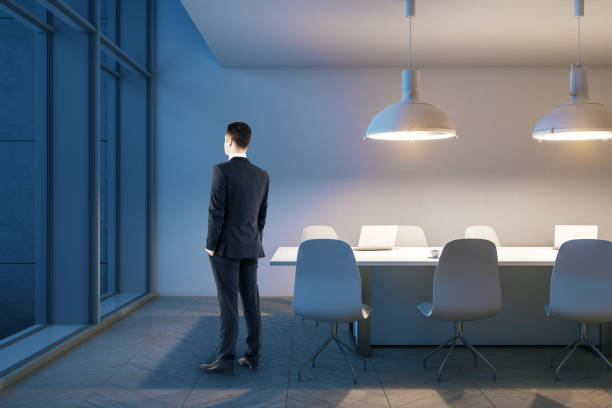 istock Businessman standing in conference room 1238307907