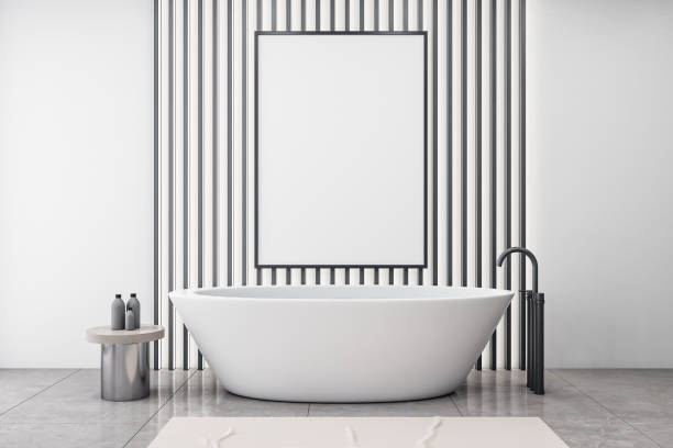 istock Clean bathroom interior with white bath and banner 1238324673