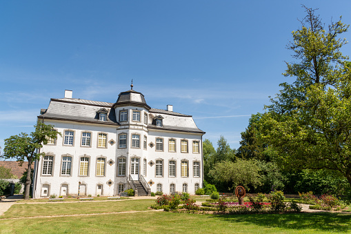 Übach-Palenberg, Germany - May 31, 2020: Zweibrüggen Castle and garden