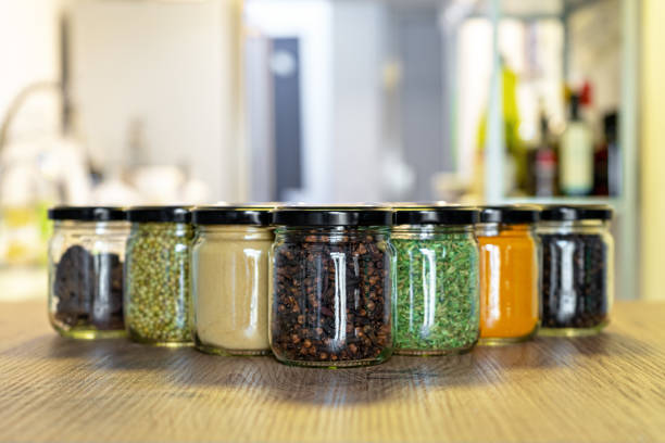istock Assorted spice and herb in glass jars for cooking, indian spices, multi colored 1238375296
