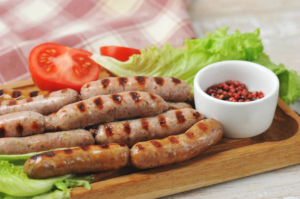 istock grilled smoked sausages, lettuce leaves, tomatoes 1238377381