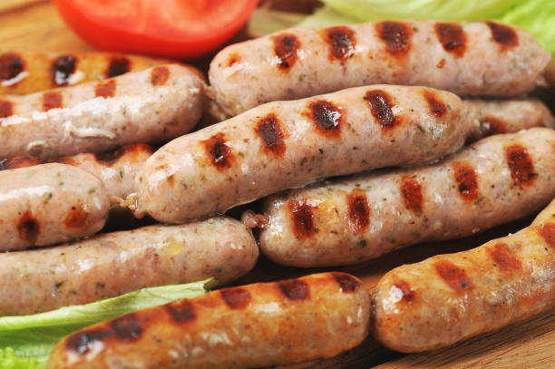 istock grilled smoked sausages, lettuce leaves, tomatoes 1238385187