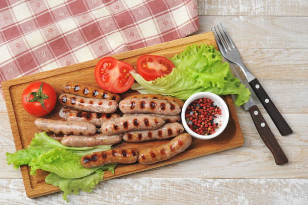 istock grilled smoked sausages, lettuce leaves, tomatoes 1238399306
