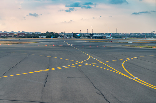 Sydney International Airport runway at dusk, New South Wales, Australia.