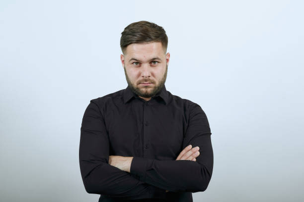 istock Cool Male Confidently Looks Forward, Attracts Hands Crossed At Chest 1238450124