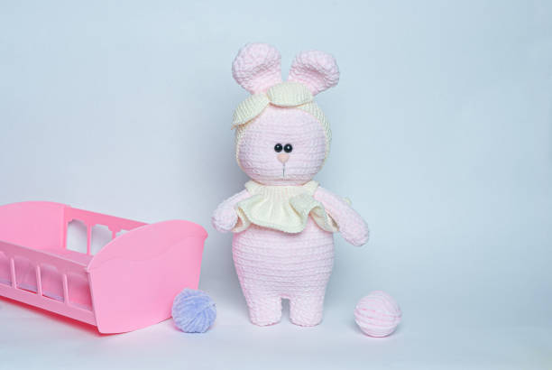 istock Soft toy knitted bunny. Plush crocheted bunny. 1238473581