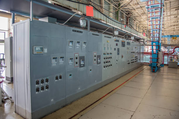 A technician oversees the control center for a public water utility company.